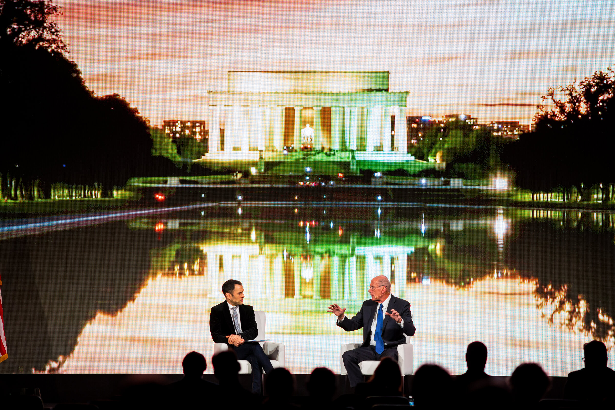 Parham Eftekhari interviewing Director of National Intelligence Dan Coats on stage