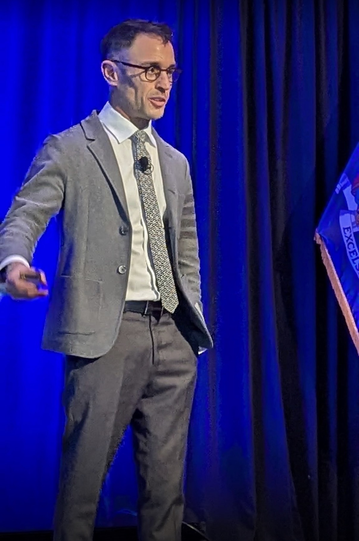 Parham Eftekhari speaking on stage
